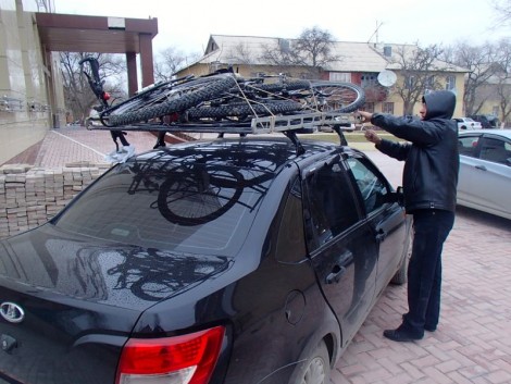 Our poor bikes relegated to the roof of a taxi in Aktau.